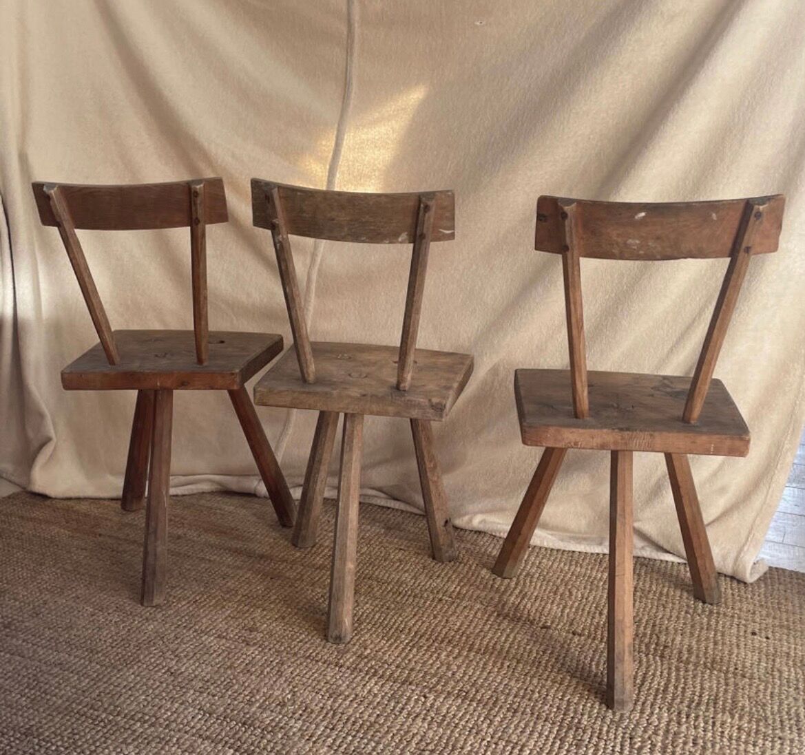 Set of three wooden tripod chairs in oak, raw art.