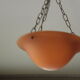 Suspension with orange glass bowl