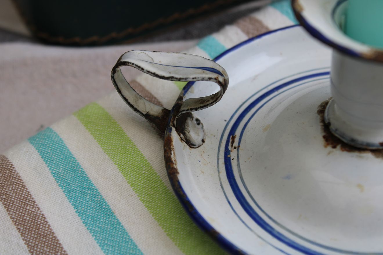 Old enamel candle holder