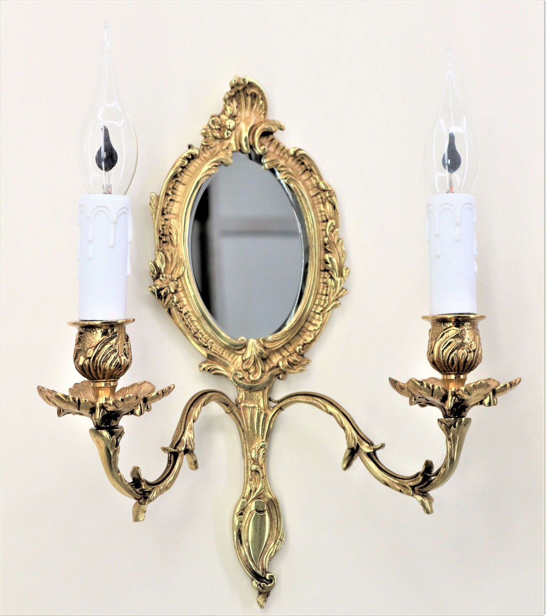 Pair of louis XV beveled mirror wall lamps in bronze by "Lucien Gau"