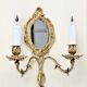 Pair of louis XV beveled mirror wall lamps in bronze by "Lucien Gau"