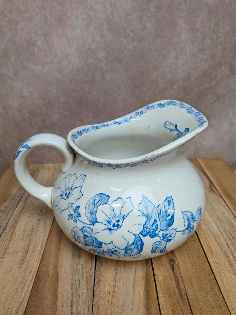 Small antique ironstone jug L.m Creil and Montereau with blue floral decoration.