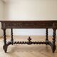 Antique solid wood carved desk in Louis XIII style.