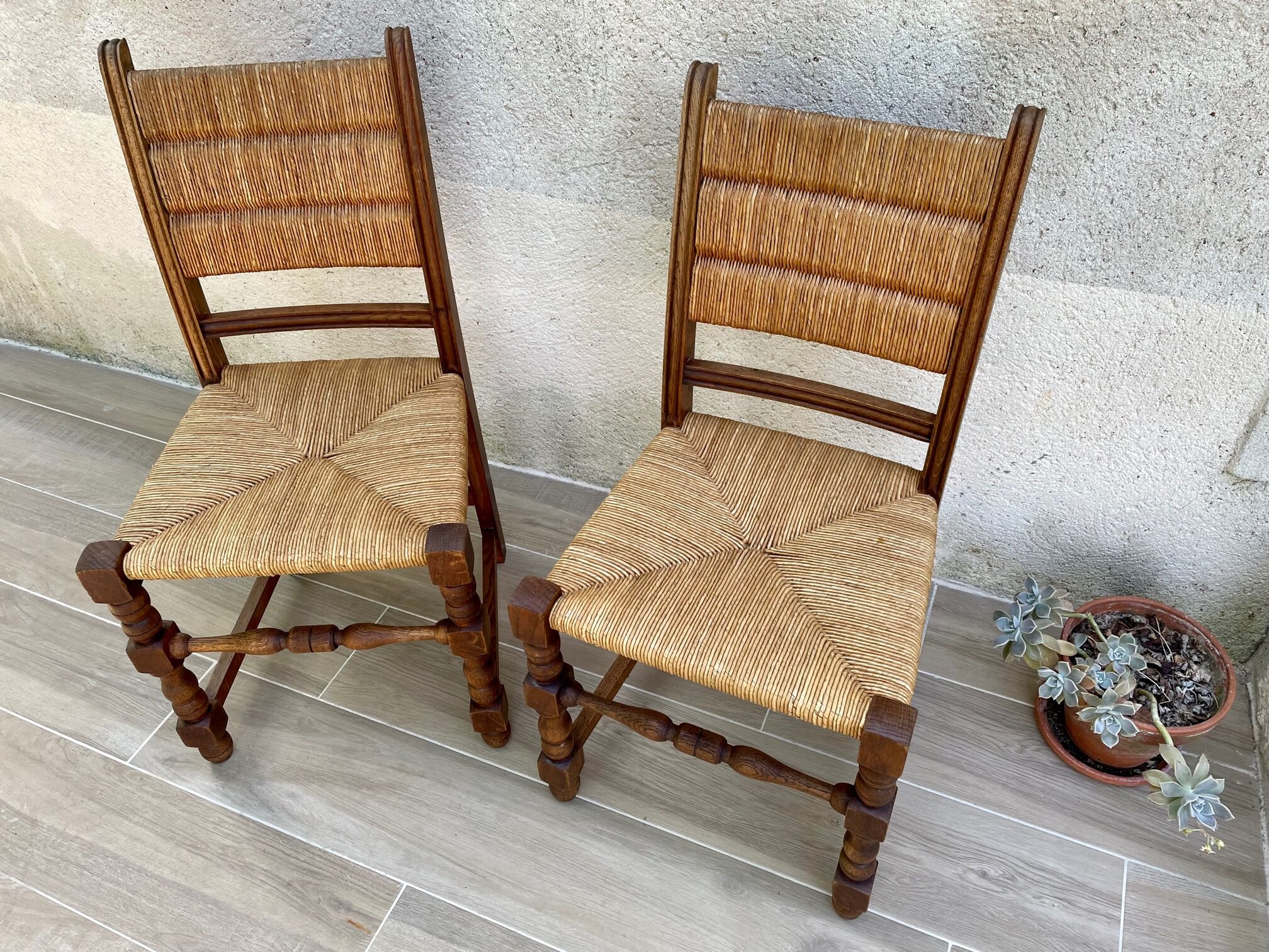 Pair of straw and solid oak chairs