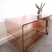 Vintage hifi, LP cabinet, TV unit made of tinted plexiglass on wheels, records.