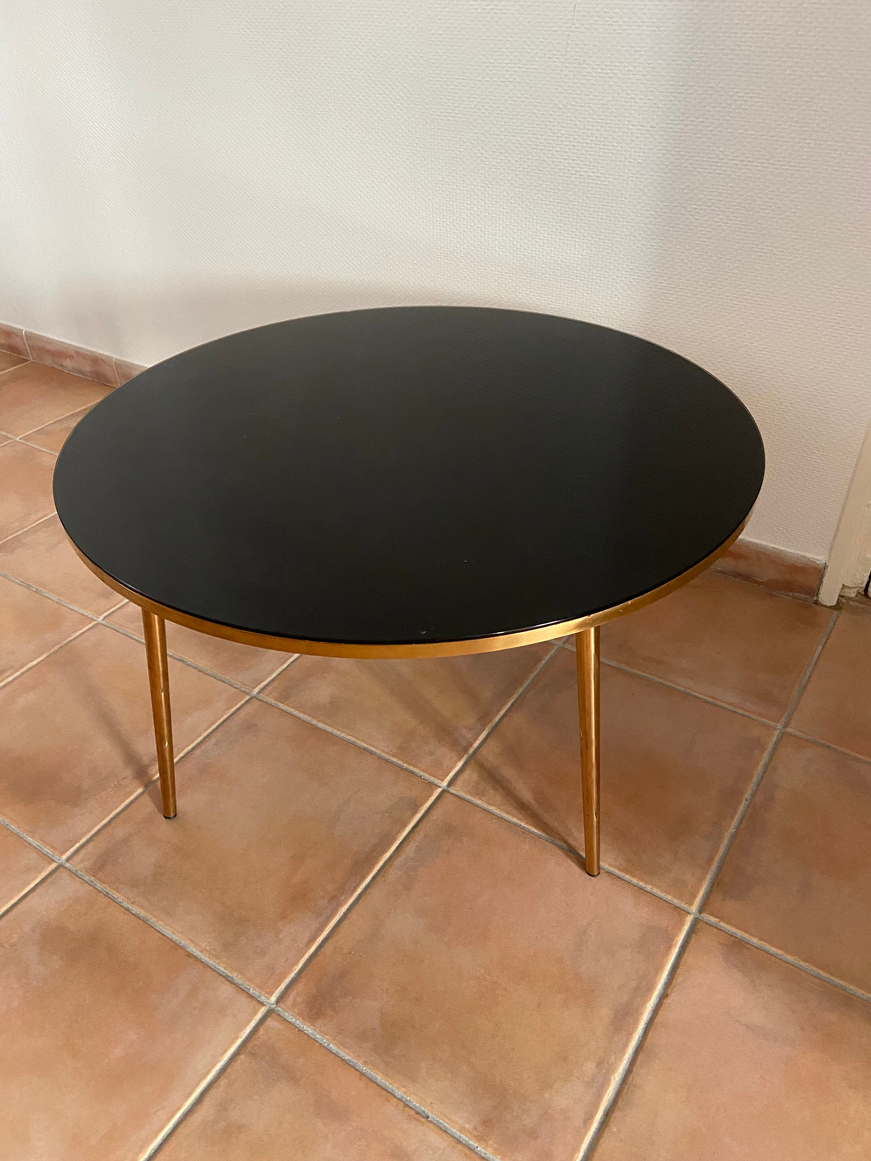 Coffee table black glass top and golden compass legs
