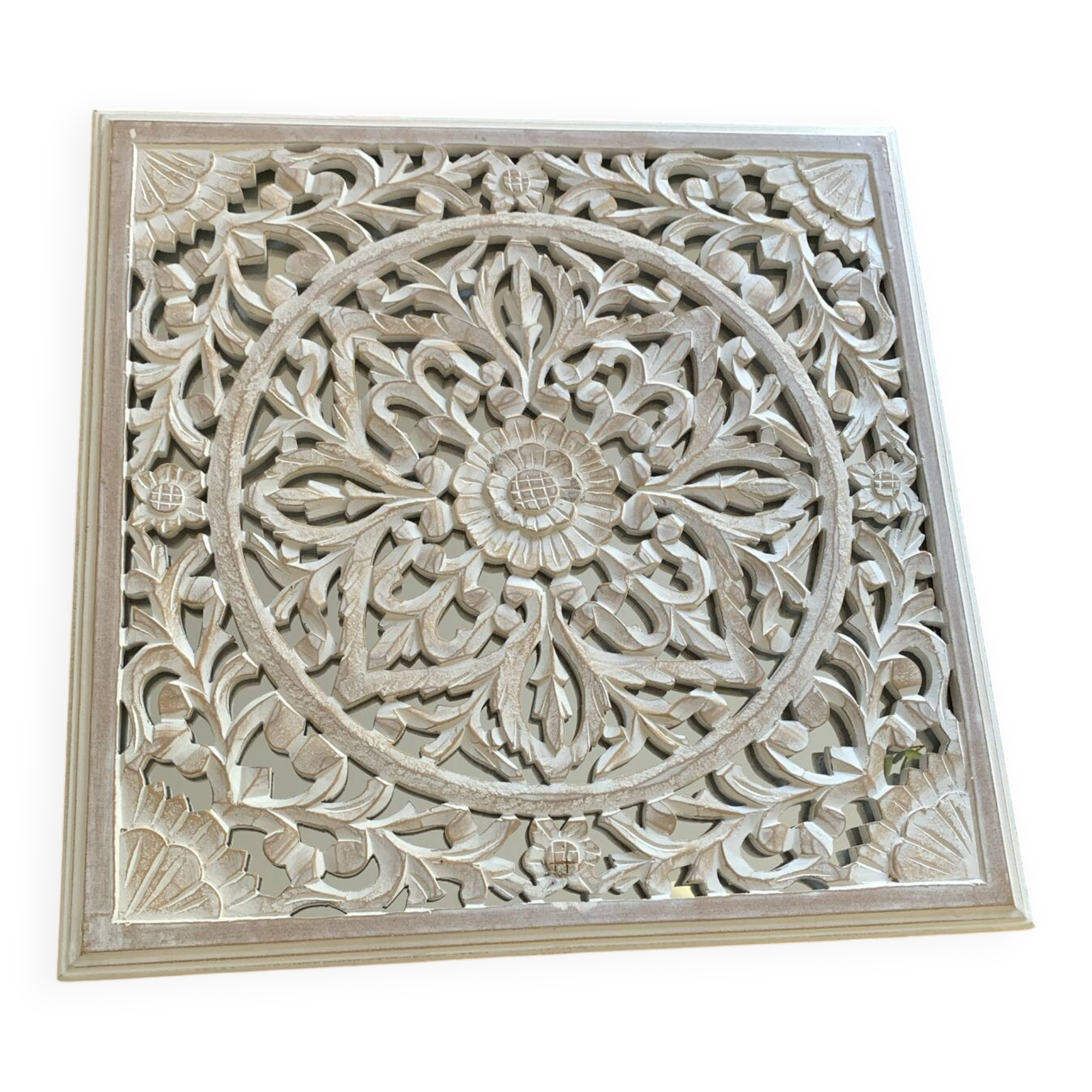 Magnificent carved frame with an interior mirror made of mango wood.