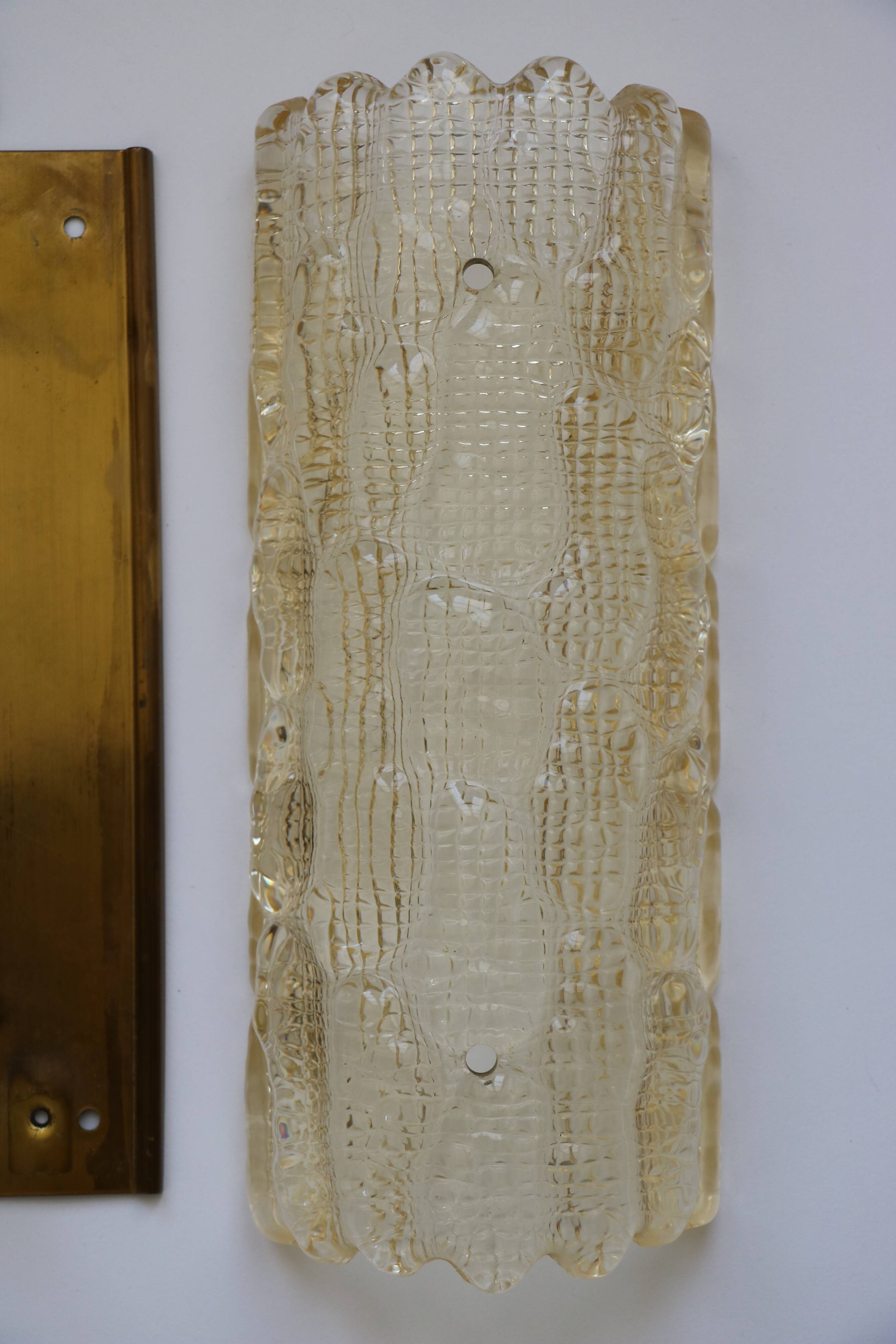 Pair of glass and brass wall lights by Carl Fagerlund for Orrefors, 1960.