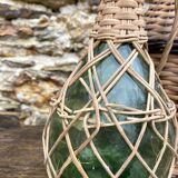 Glass bottles and rattan, woven wicker