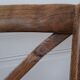 Curved wooden armchair