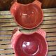 Pair of red ceramic hen dish