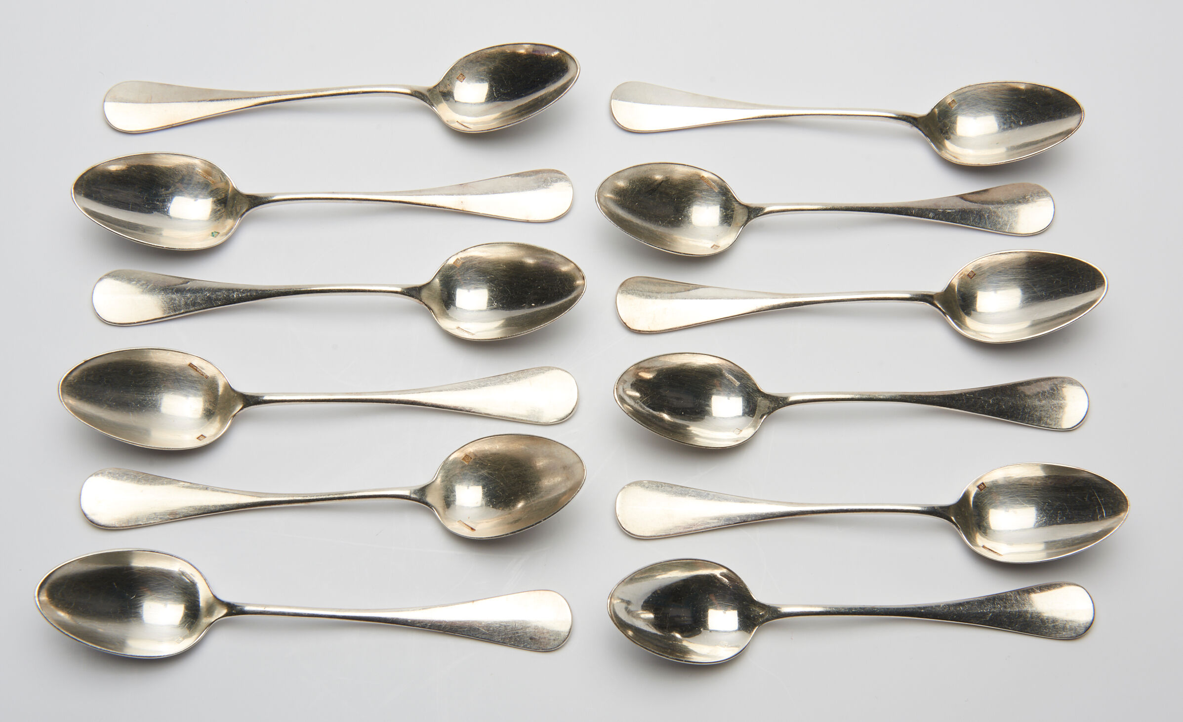 12 small silver metal spoons engraved "FB", early XXth