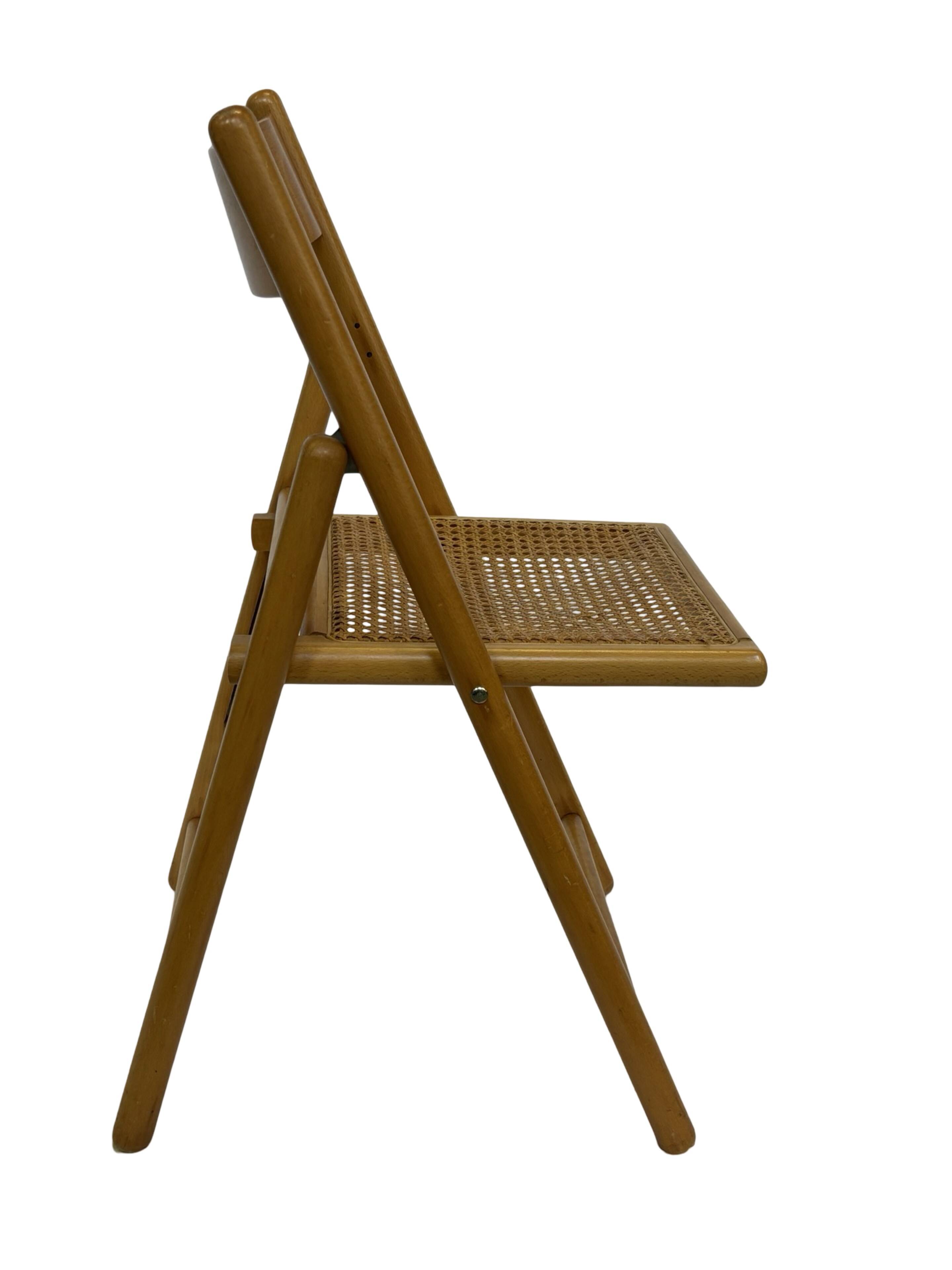 Vintage wooden folding chair with rattan seat 80s minimalist design