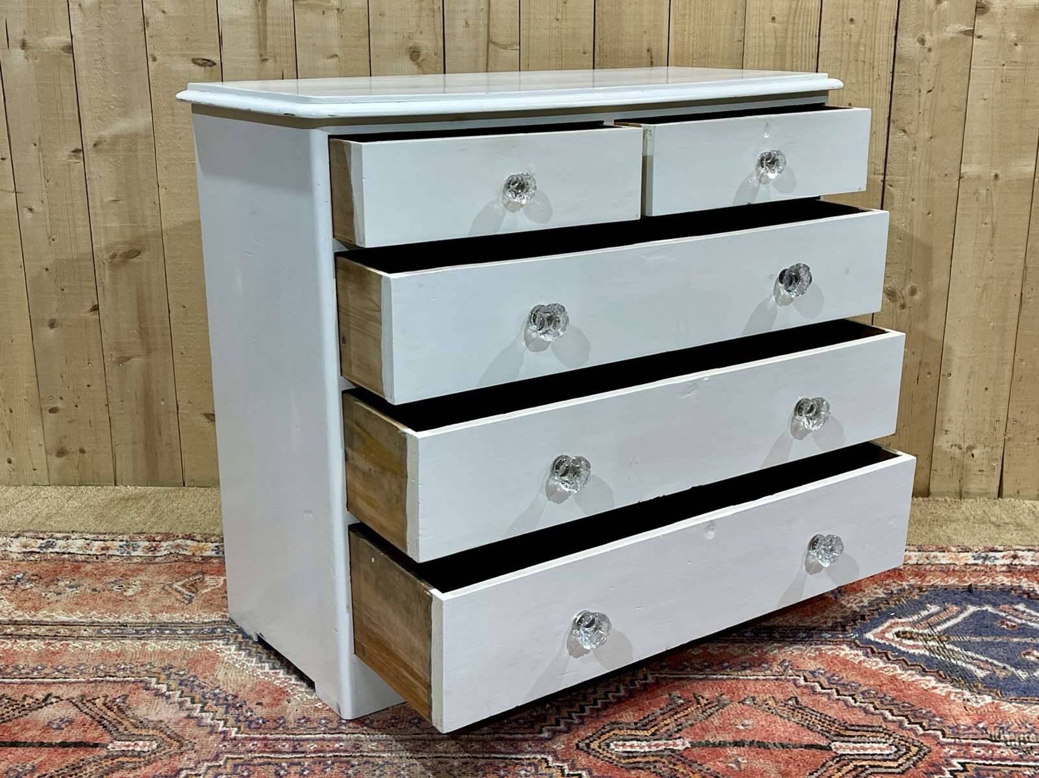 English chest of drawers painted in fir with glass knobs, 19th century