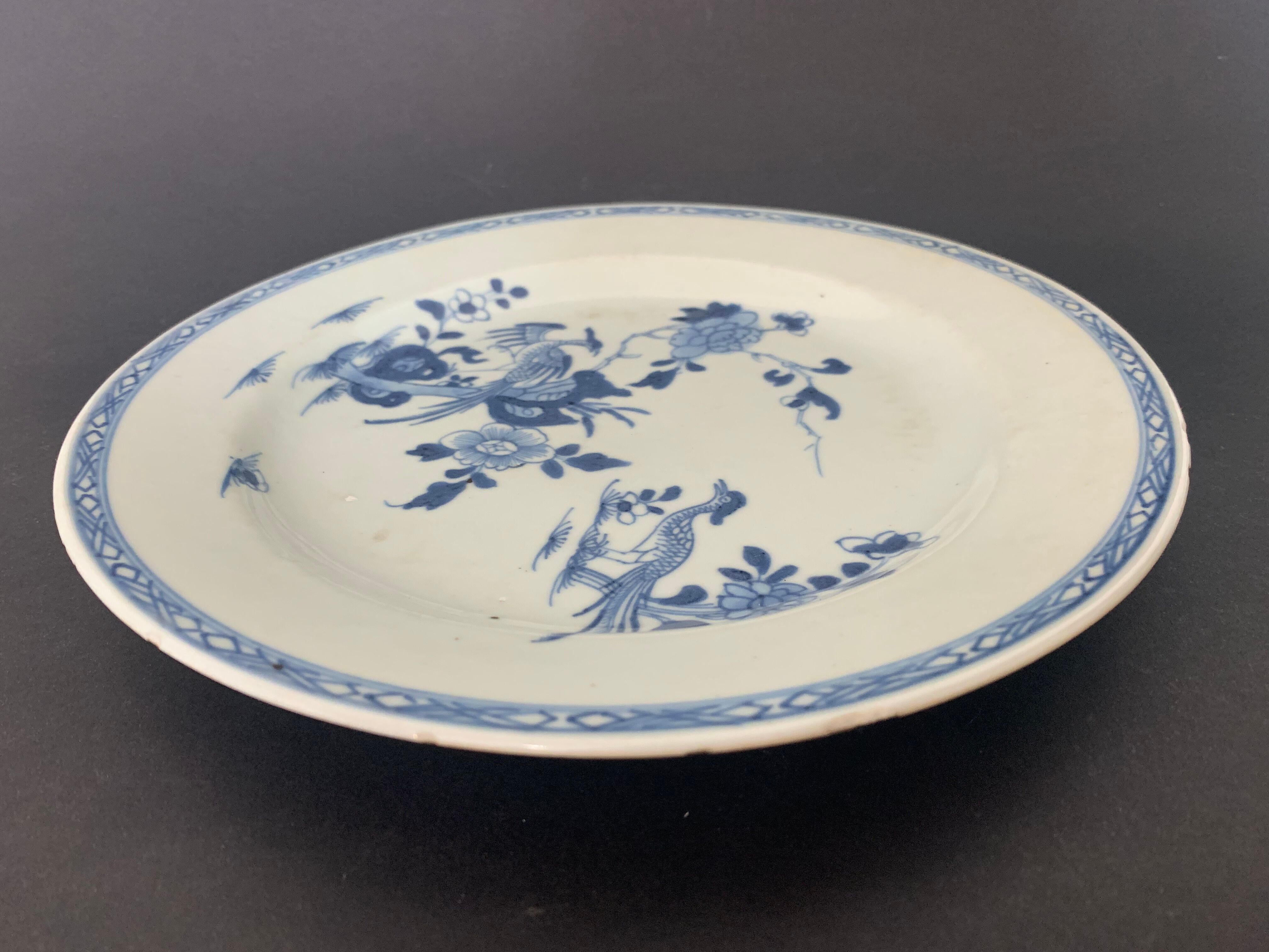 Blue and white porcelain plate of the blue family, 19th century