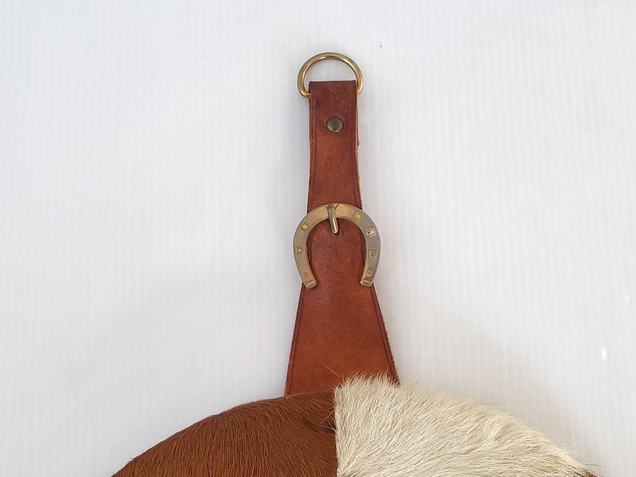 Vintage 1970s cowhide horseshoe mirror