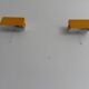 Pair of yellow metal wall lights from the mid-century by N Leuchten, 1960s, Germany.
