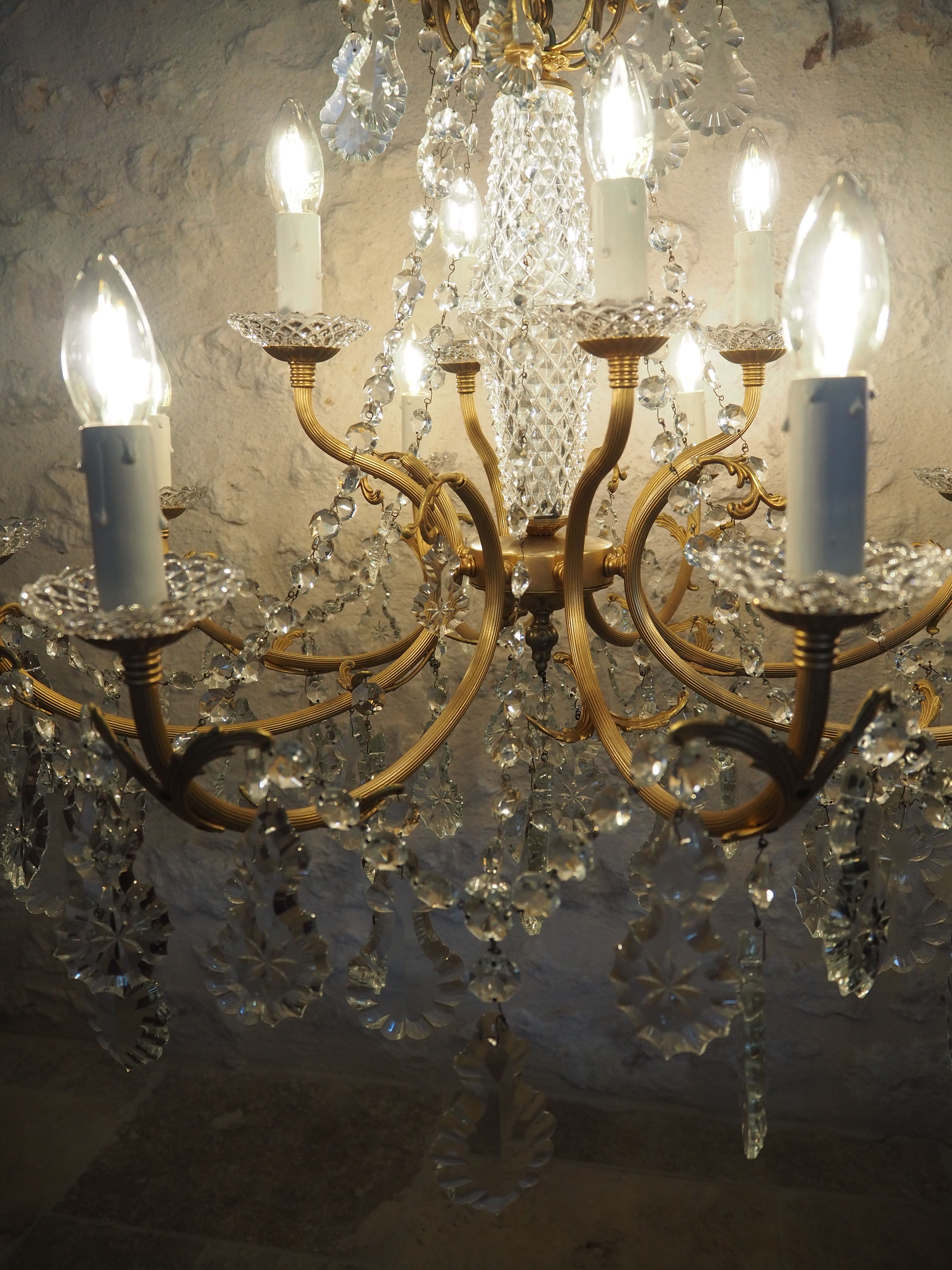 Chandelier 12 lamps with grapevines in crystal, bronze and regulated