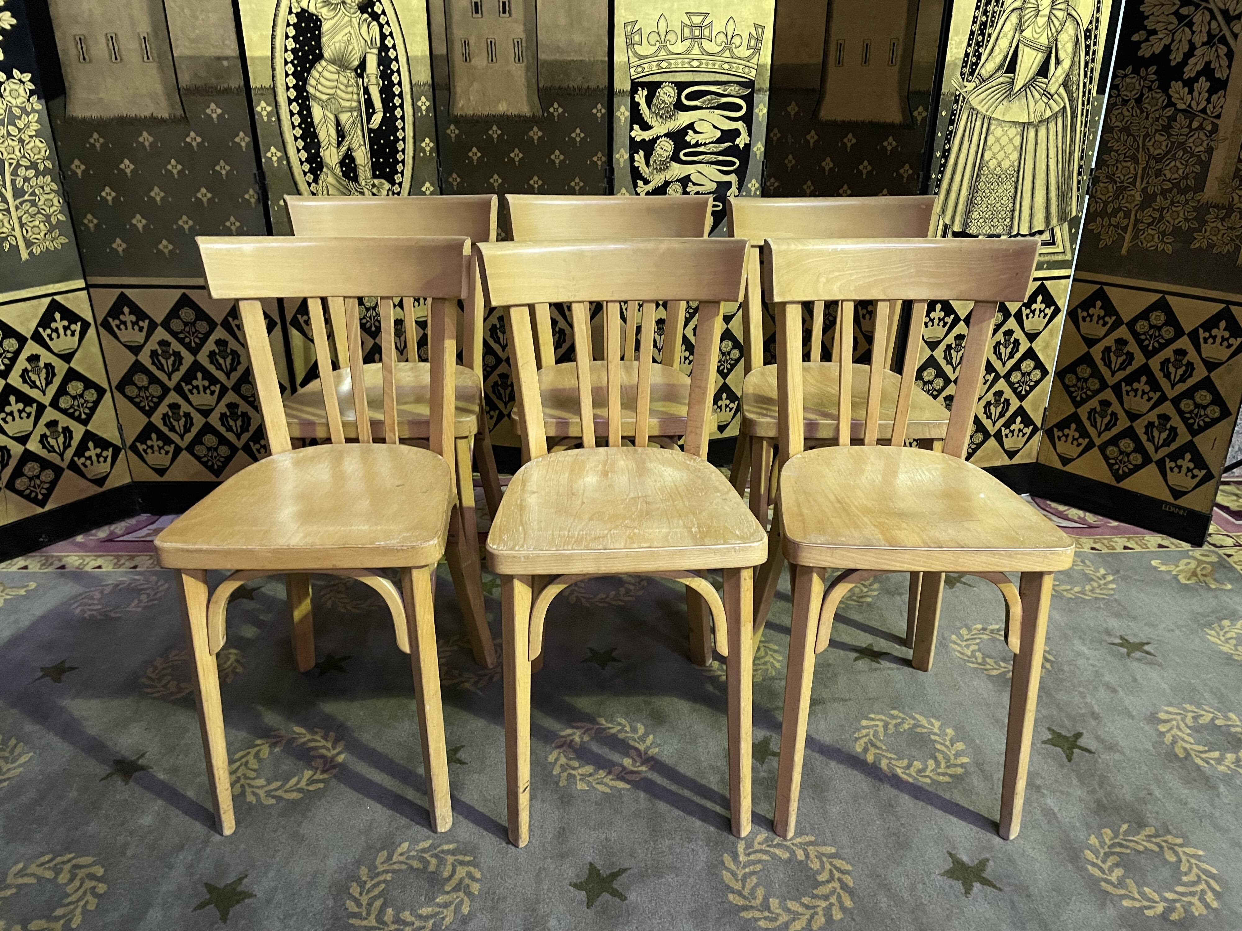Suite of 6 bistro chairs signed "baumann"