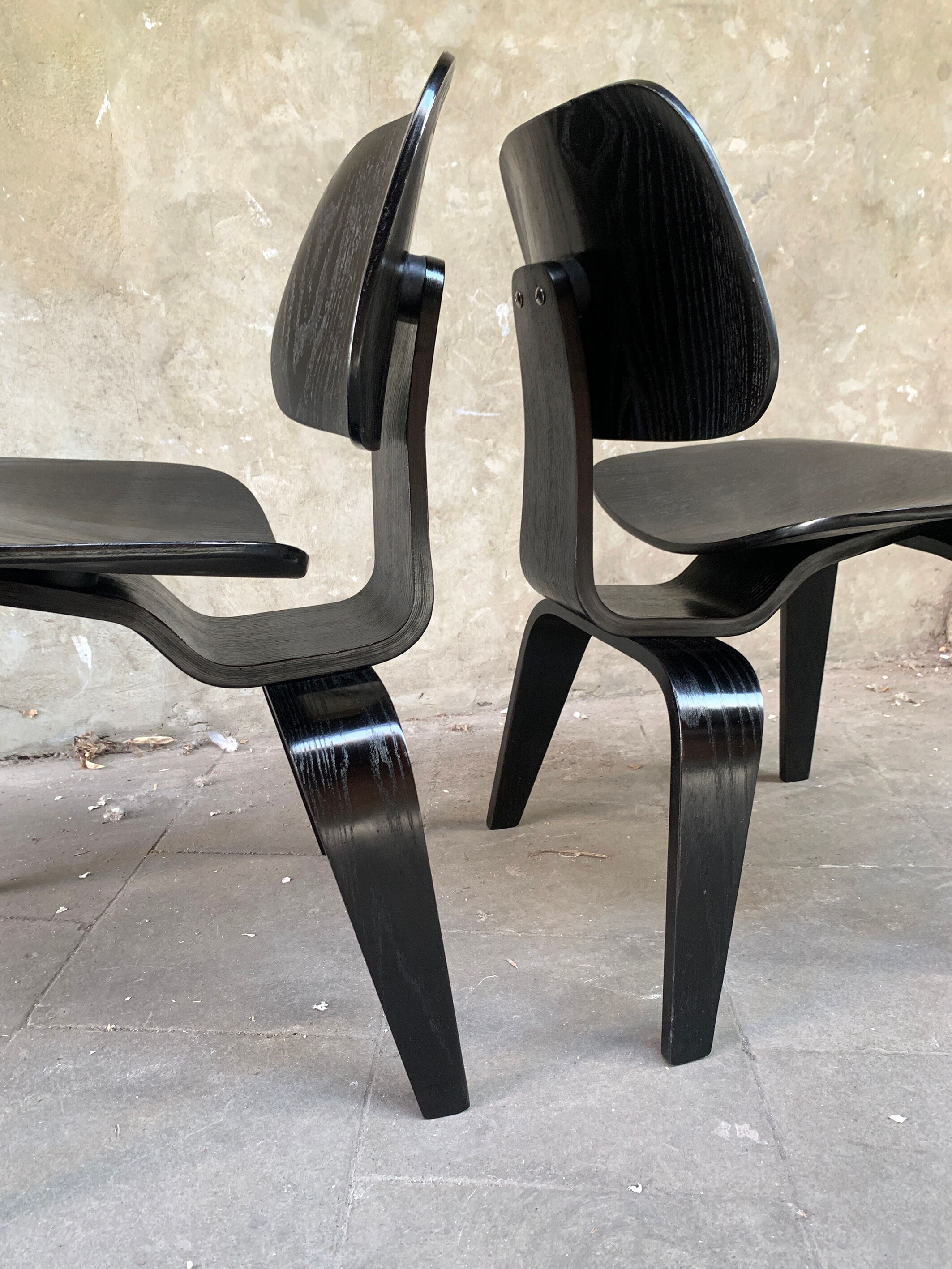 Pair of DCW chairs by Charles & Ray Eames in Black for Herman Miller 1950