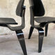 Pair of DCW chairs by Charles & Ray Eames in Black for Herman Miller 1950