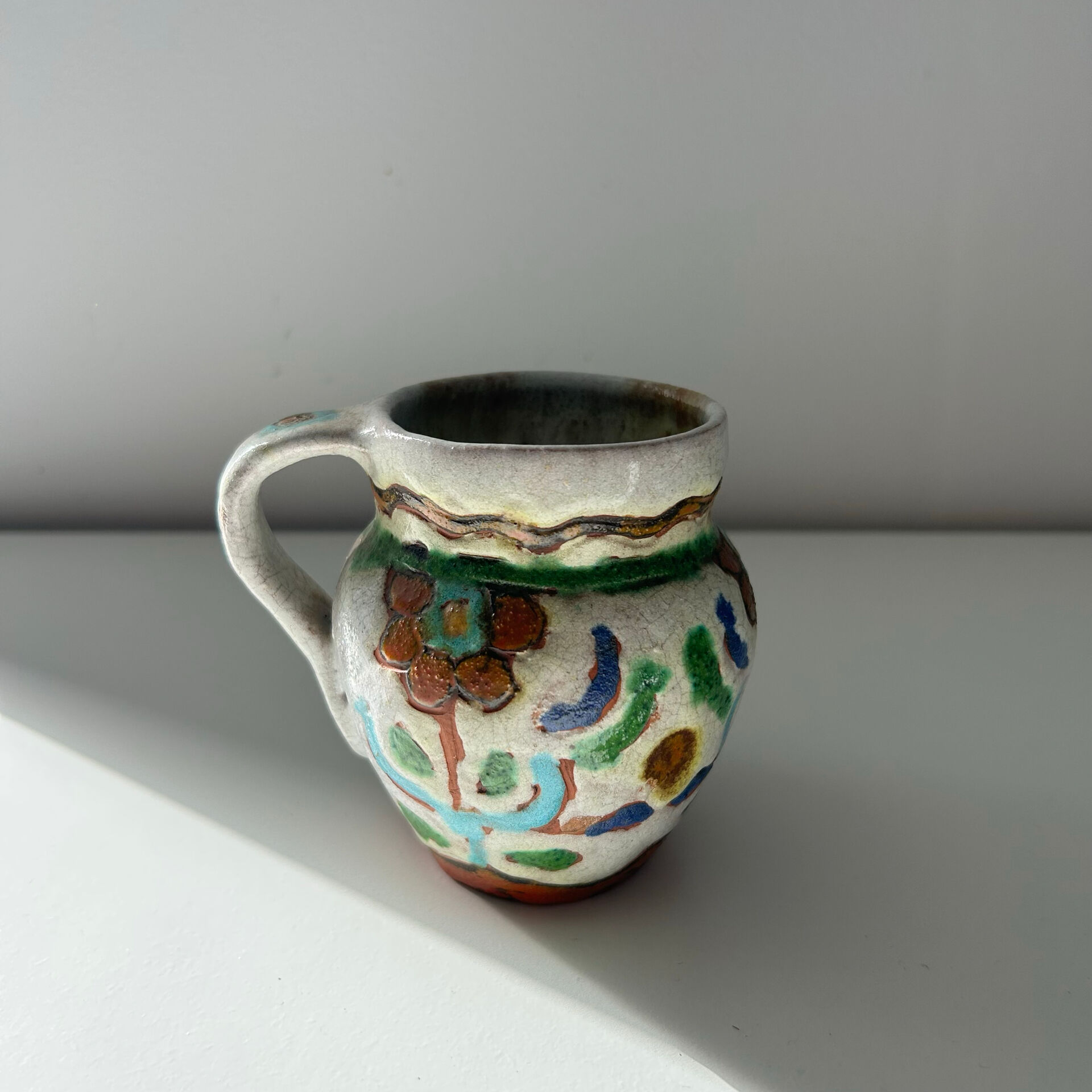 Small floral jug signed