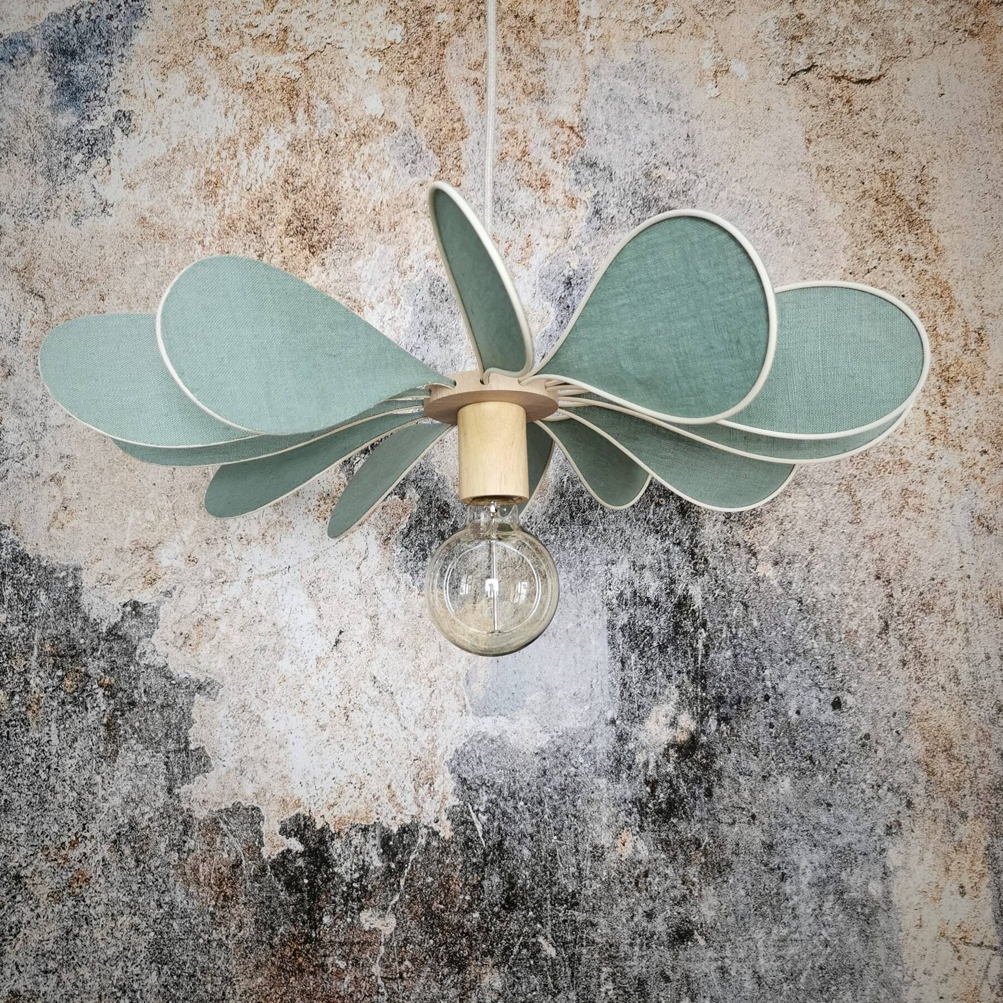12-blade propeller suspension in rattan and celadon green linen