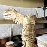 "Winged Victory of Samothrace", beige plaster statuette