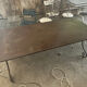 Old wrought iron table and its armchairs and chairs for outdoor use.