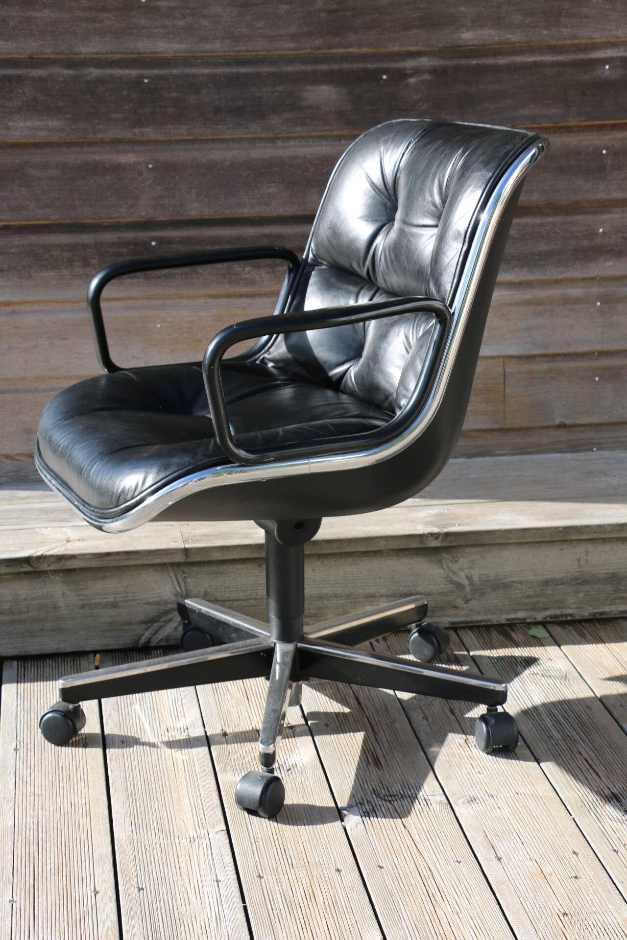 POLLOCK black leather reclining armchair with casters