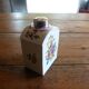 Floral porcelain bathroom bottle with engraved silver cap