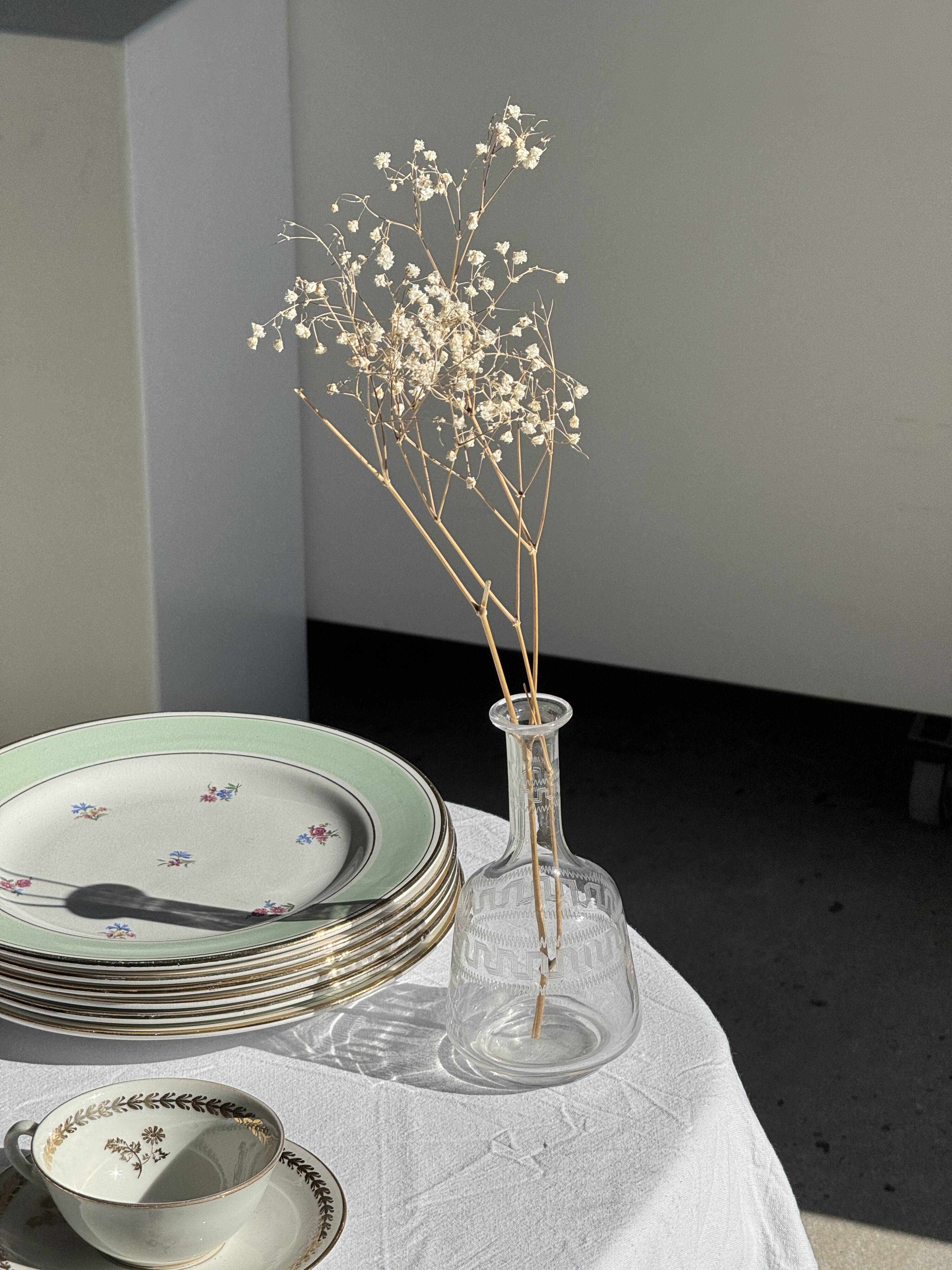 Set of 9 vintage turquoise deep plates with gold trim and pink flowers.