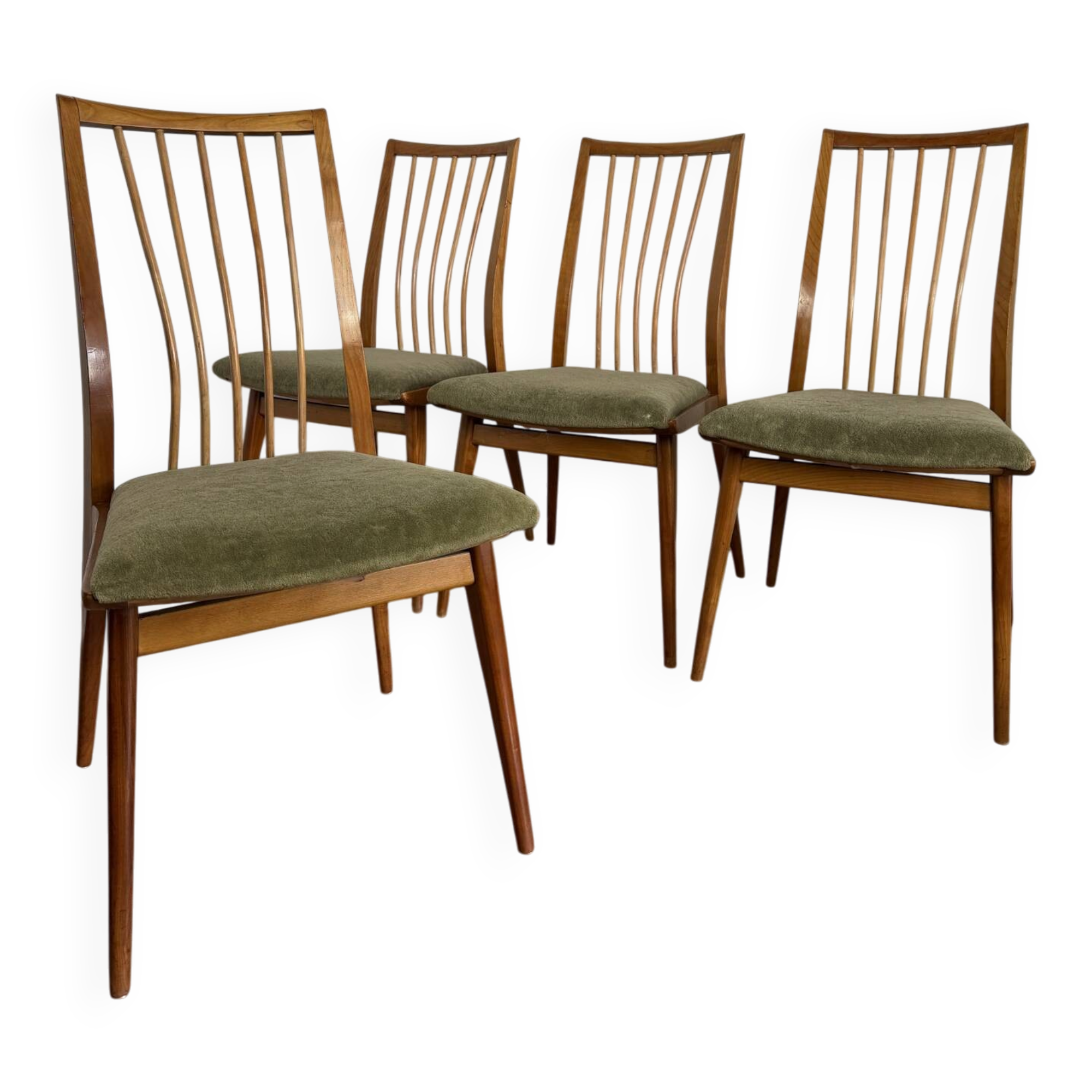 Scandinavian chairs with green velvet upholstery.