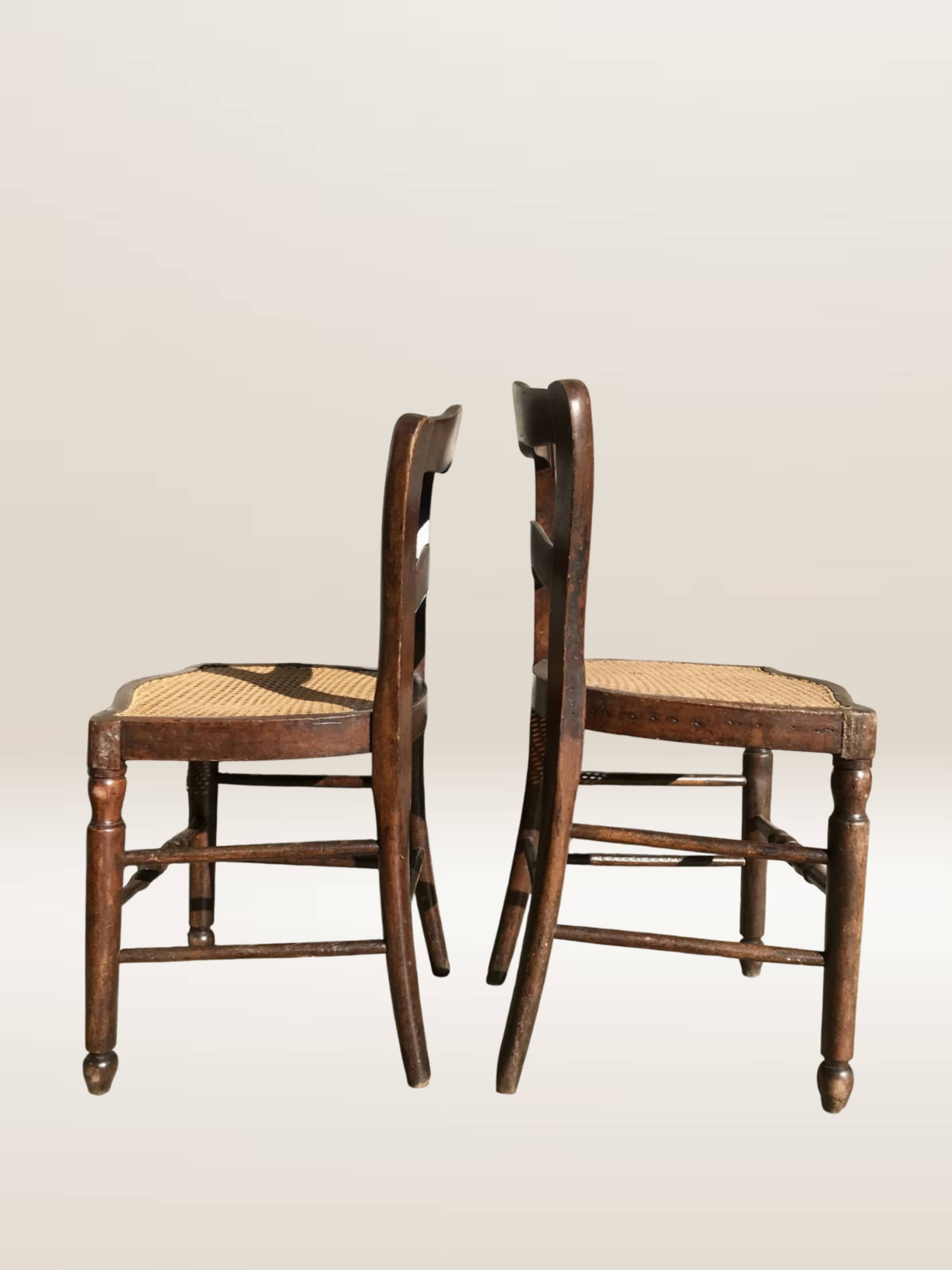 Pair of turned wooden chairs with caning