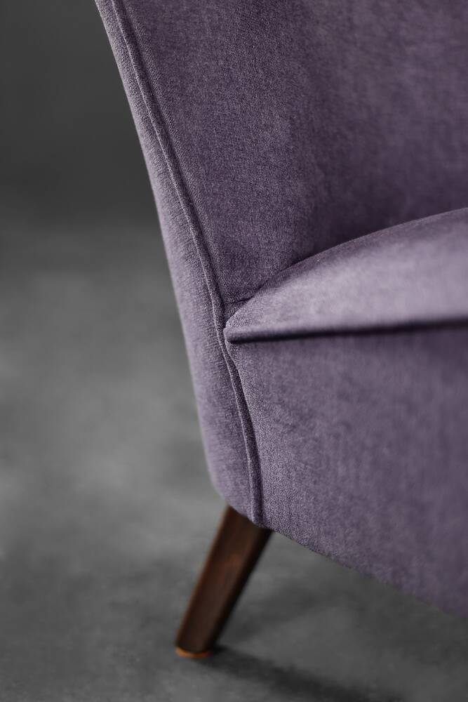 High-backed wing chair in oak and purple fabric, vintage Scandinavian style from the 1950s.