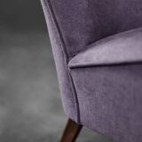 High-backed wing chair in oak and purple fabric, vintage Scandinavian style from the 1950s.
