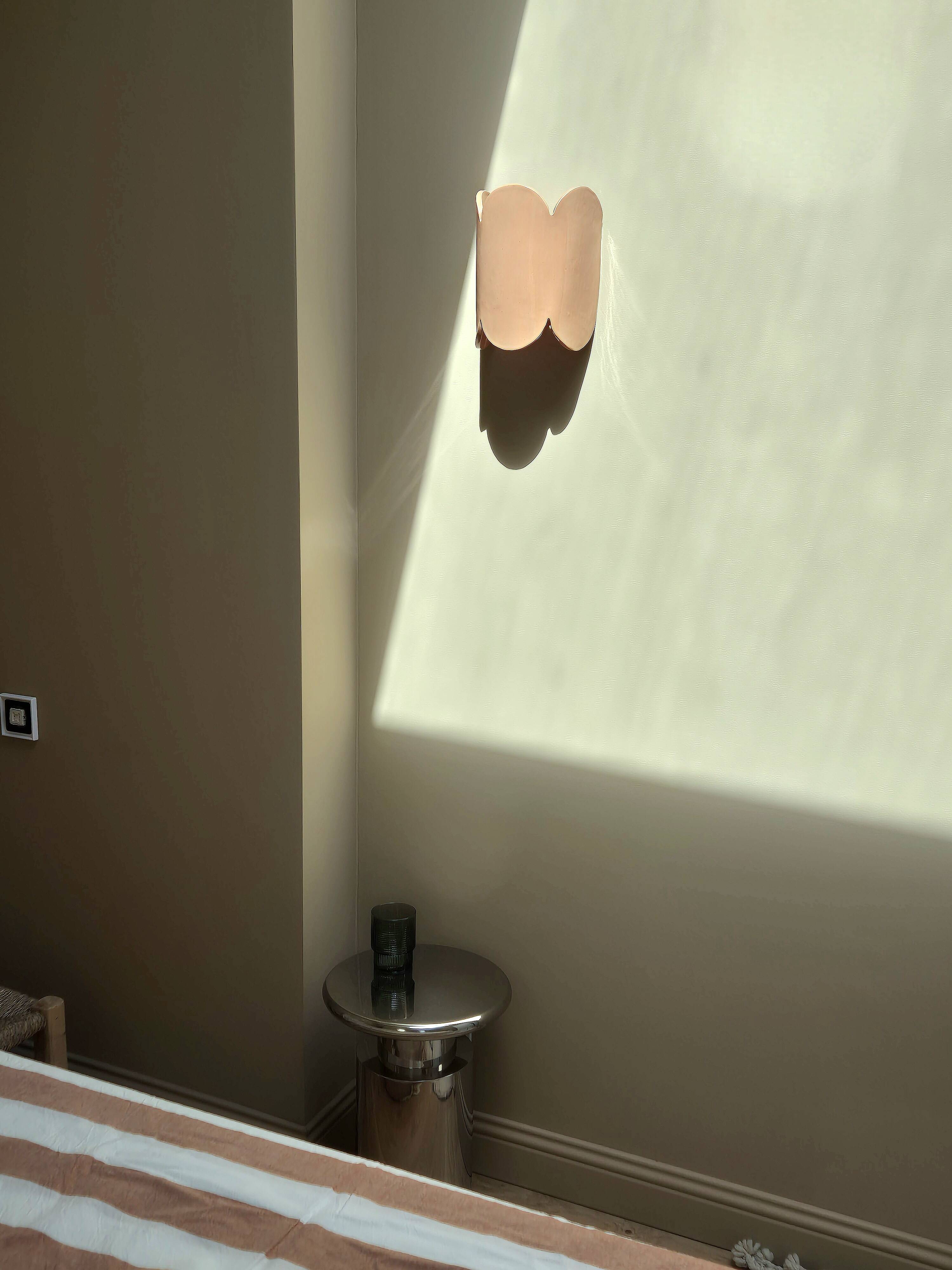 Mocha enamelled stoneware wall light (small model).