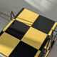 Vintage black and yellow checkered rolling bar trolley