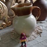 Set of three glazed stoneware pitchers