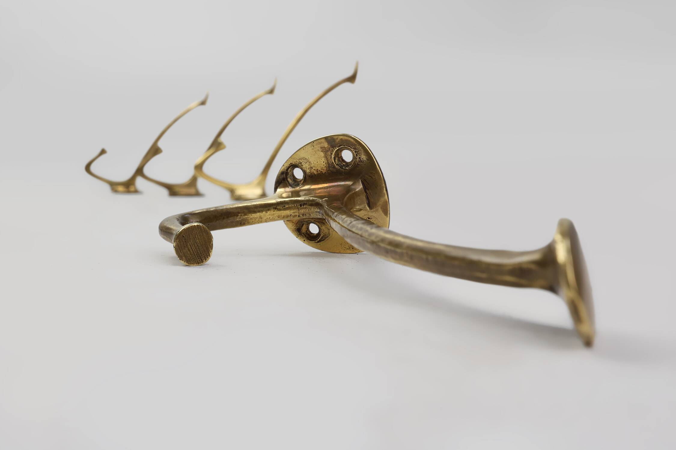 Set of 4 Adolf Loos brass art nouveau wall hooks, Vienna, Austria ca. 1910