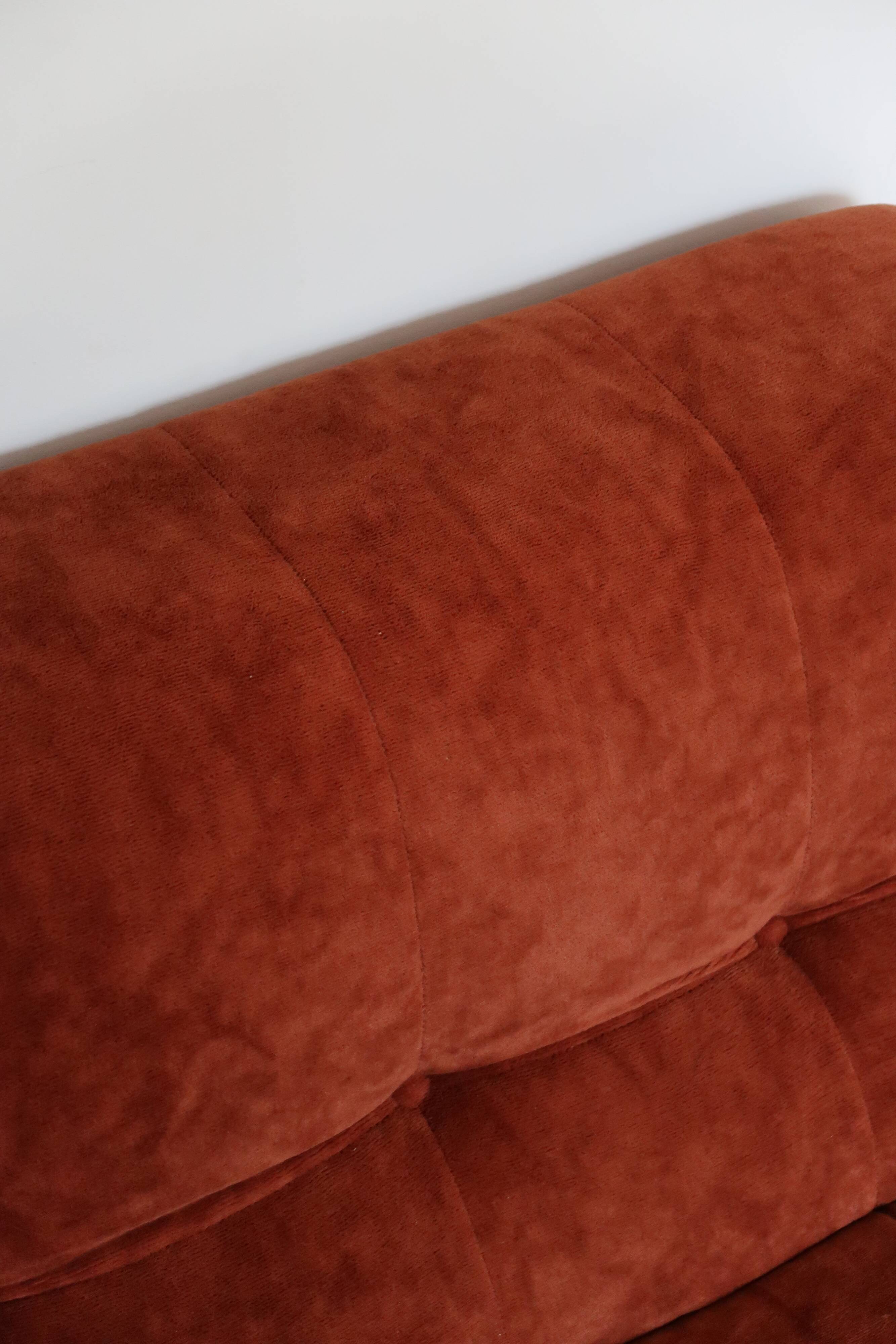 Rusty velvet low chair without arms