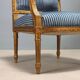 Chairs and antique armchairs in neoclassical style from the 19th century.