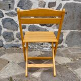 Pair of folding chairs in blond wood