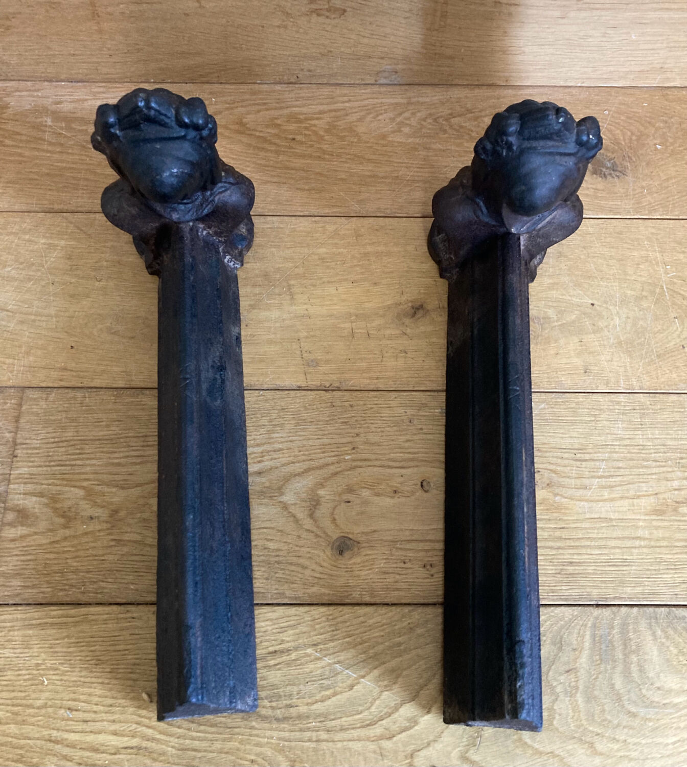 Pair of cast iron andirons from the 19th century, busts of women