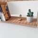 Vintage wall shelf or freestanding wicker in bohemian style.