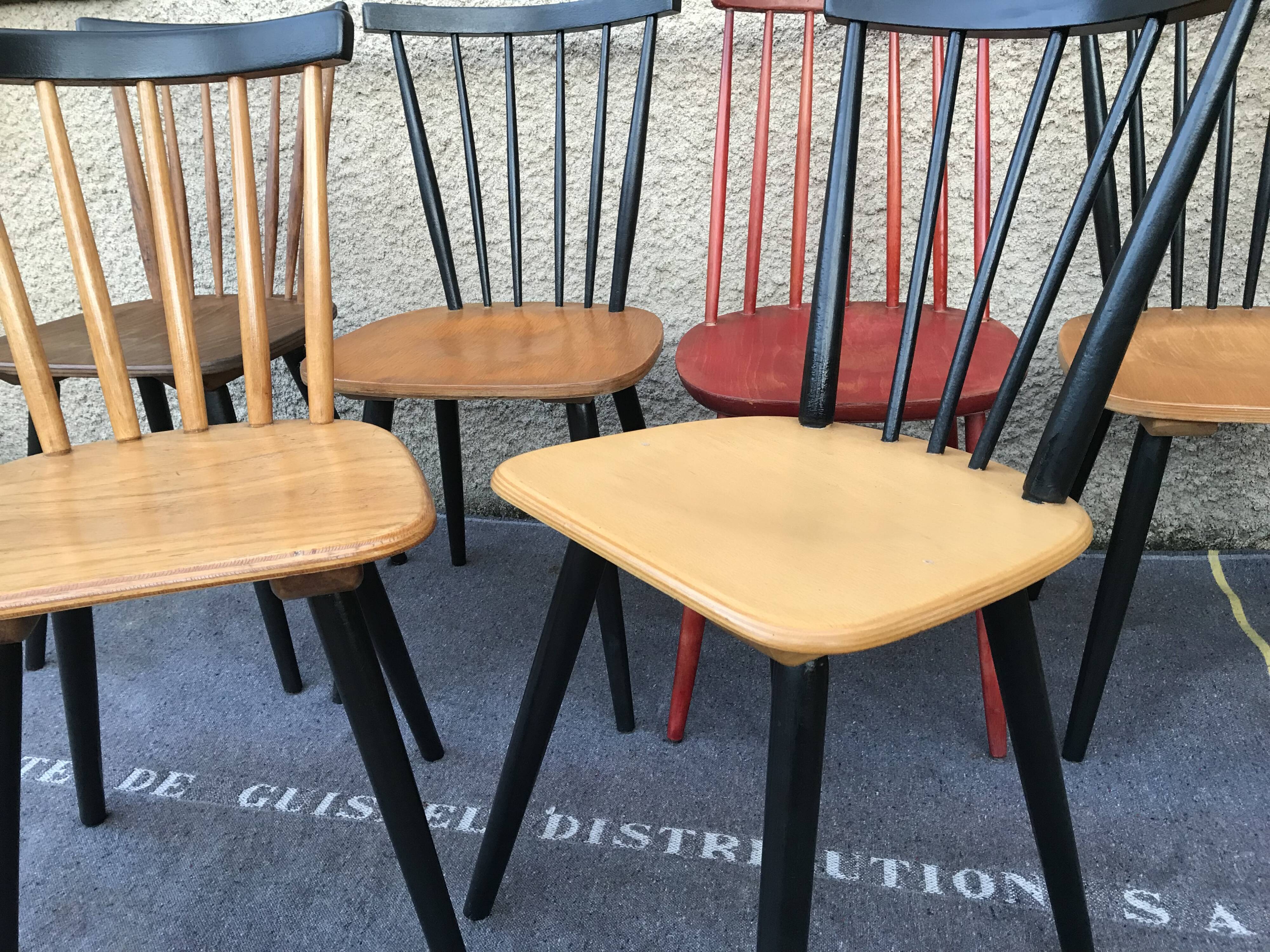 Set of 6 mismatched vintage chairs with bars and compass legs