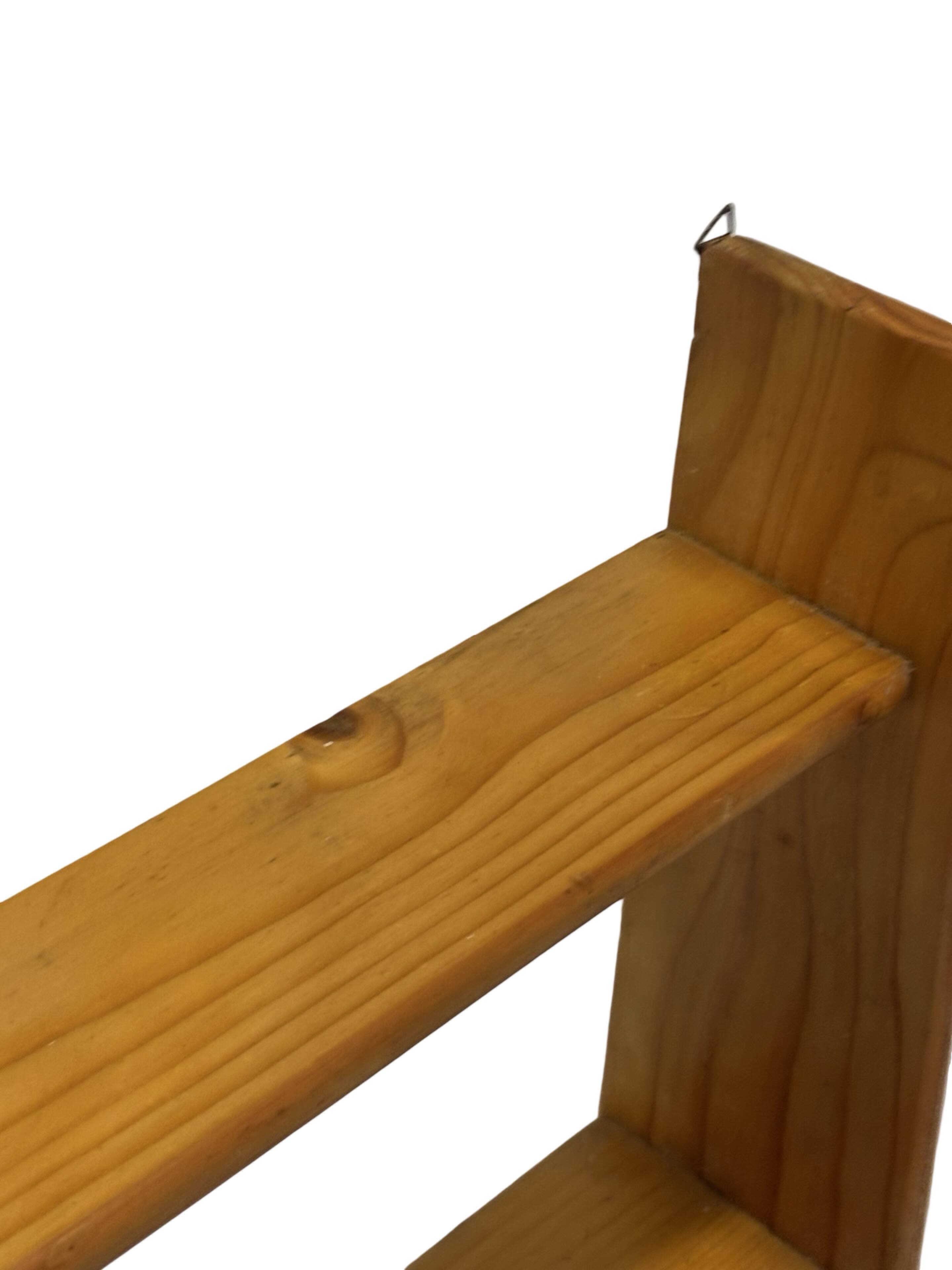 Vintage wooden wall shelve rack bookshelf in pinewood minimalist design