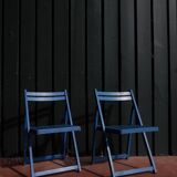 Set of two blue folding chairs