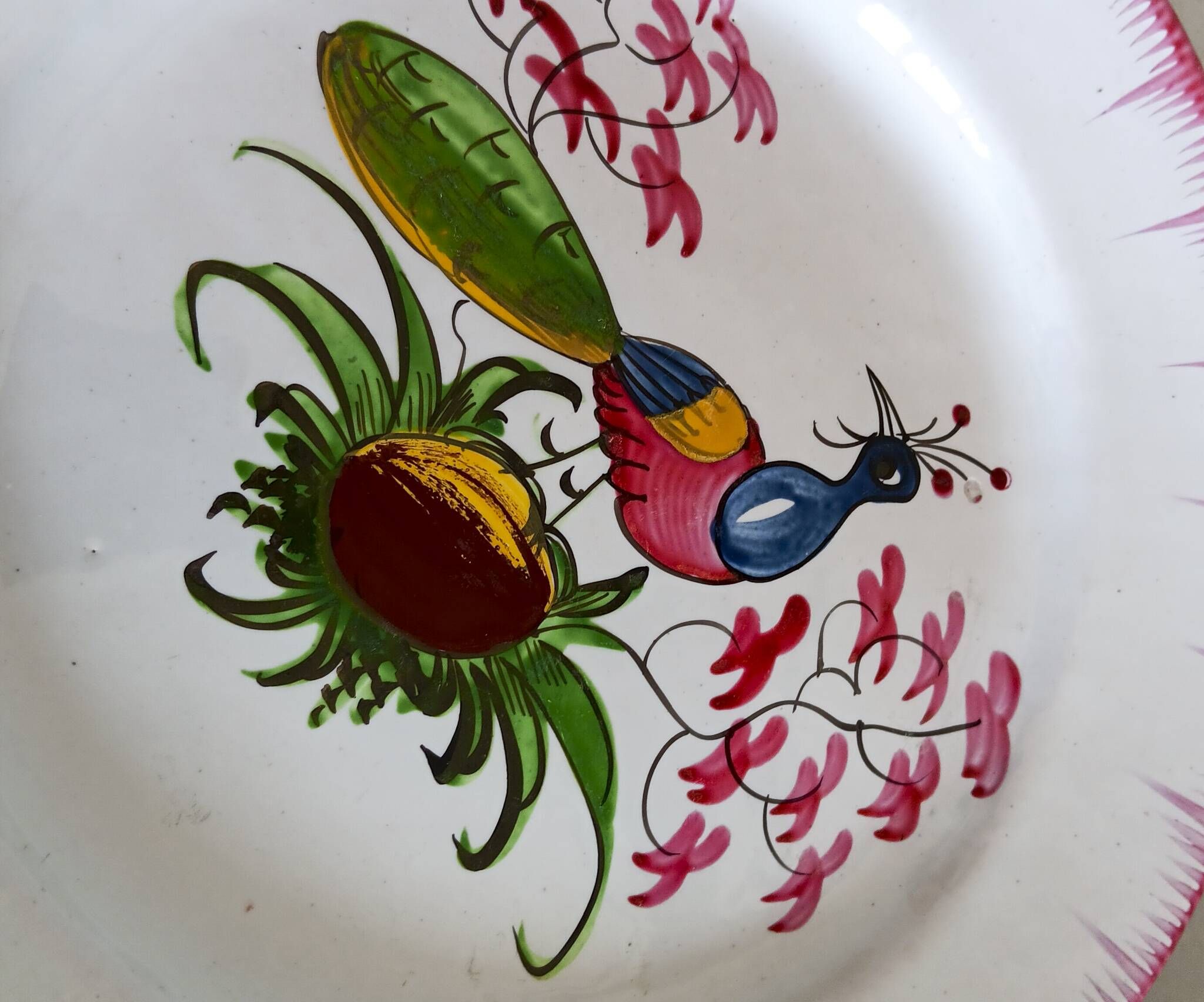 Rare Les Islettes earthenware plate decorated with a peacock. 19th century.