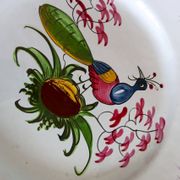 Rare Les Islettes earthenware plate decorated with a peacock. 19th century.